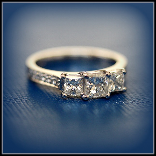 18ct White Gold Princess Three Stone Diamond set with Diamonds on the band Torres Jewel Co