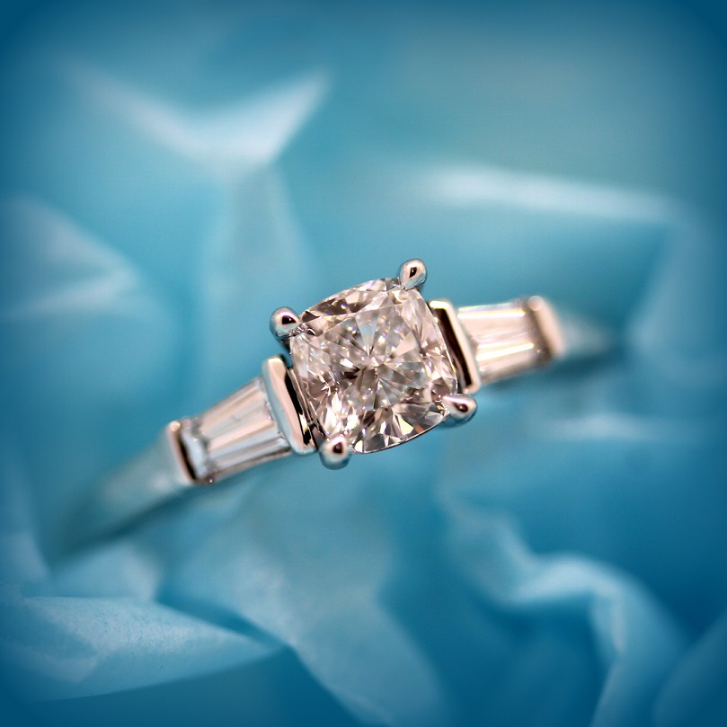 Cushion Cut Diamond with Tapered Baguette Cut Diamonds in a bar setting in 18ct White Gold Torres Jewel Co