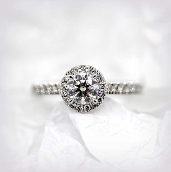 18ct White Gold Round Brilliant Cut Diamond ring with a Diamond halo and band. Torres Jewel Co